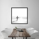 Shop Surfer On The Sand (Square) Canvas Art Print-Black, Boho, Coastal, Grey, People, Photography Canvas Prints, Square, Tropical, View All, White-framed wall decor artwork