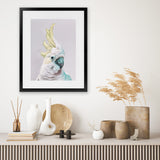 Shop Charlie The Cockatoo (Ice) Art Print-Animals, Baby Nursery, Birds, Pink, Portrait, Tropical, View All, White, Yellow-framed painted poster wall decor artwork