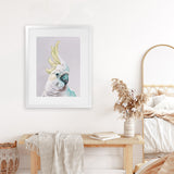 Shop Charlie The Cockatoo (Ice) Art Print-Animals, Baby Nursery, Birds, Pink, Portrait, Tropical, View All, White, Yellow-framed painted poster wall decor artwork